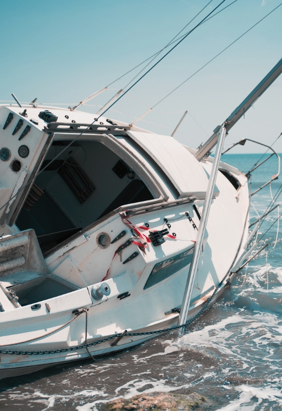 sailboat wrecked and stranded on the beach