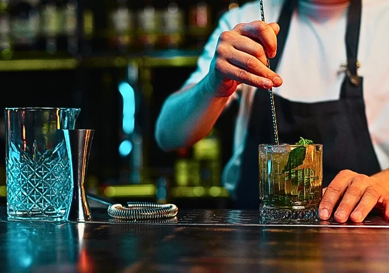 Bartender making a cocktail.