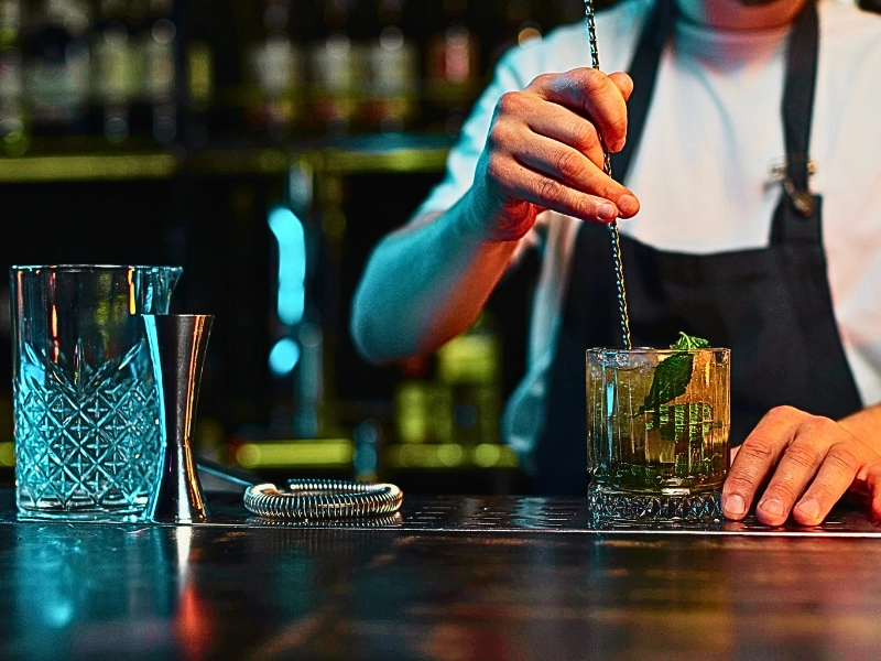 Bartender making a cocktail.
