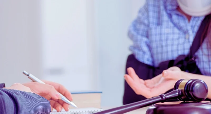 Injured employee visiting lawyer for advice on insurance. Need a Lawyer for a Workers' Comp Claim