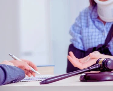 Injured employee visiting lawyer for advice on insurance. Need a Lawyer for a Workers' Comp Claim